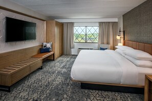 Premium bedding, desk, laptop workspace, blackout curtains