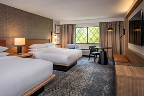 Premium bedding, desk, laptop workspace, blackout drapes