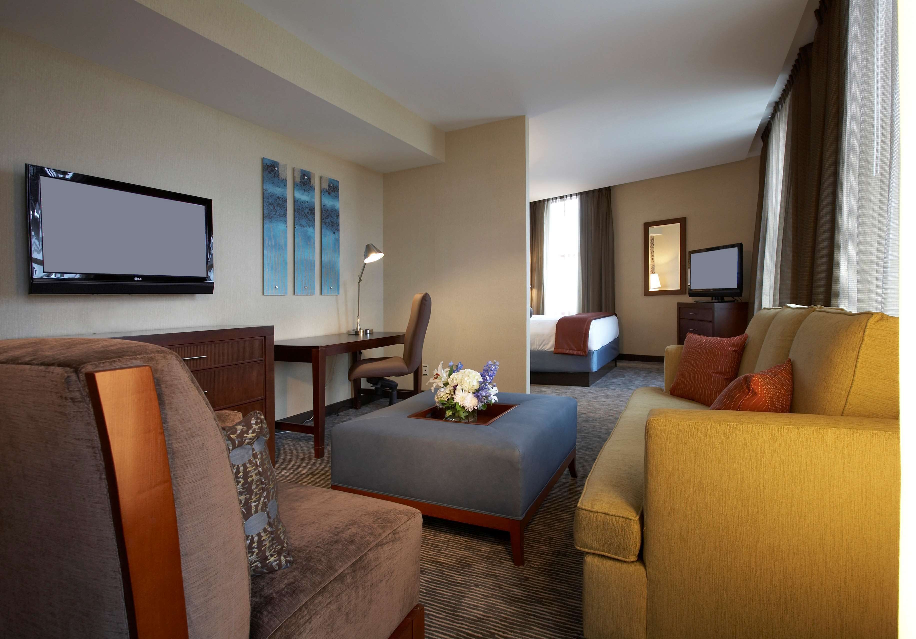 Premium bedding, desk, laptop workspace, blackout curtains