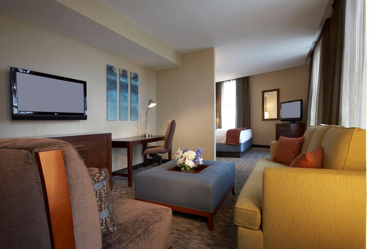 Premium bedding, desk, laptop workspace, blackout curtains