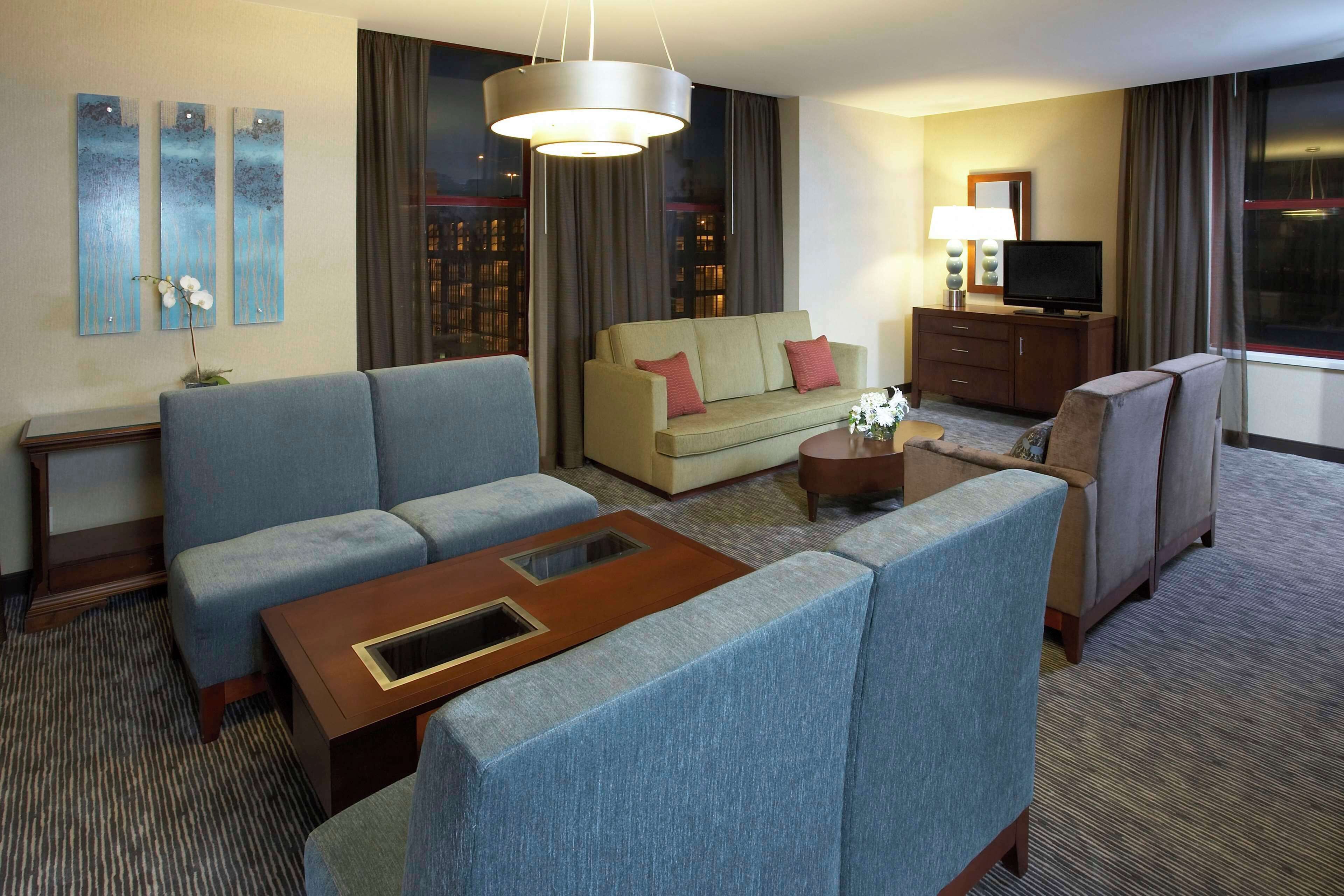 Premium bedding, desk, laptop workspace, blackout drapes