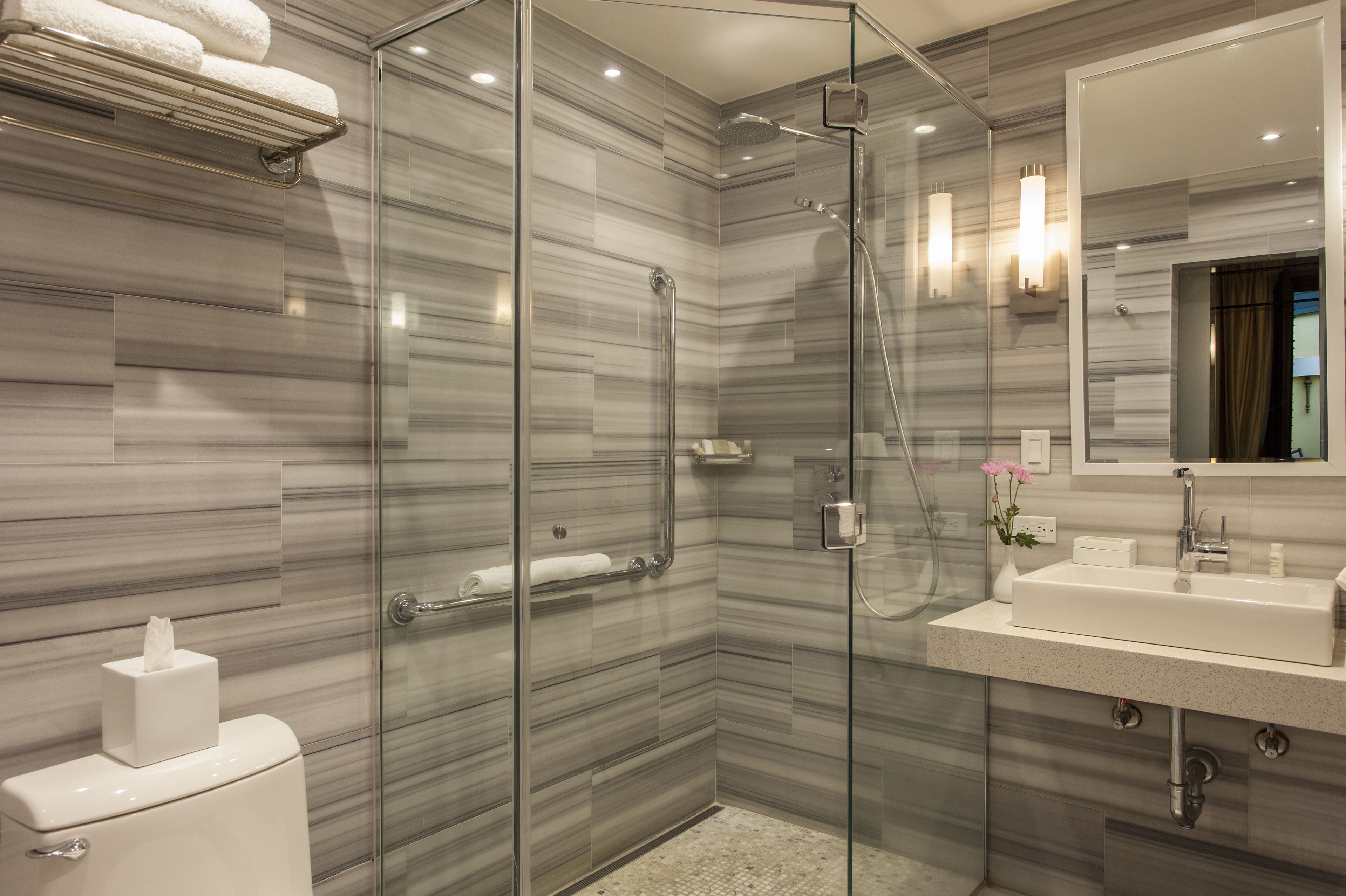 designer toiletries, hair dryer, bathrobes, slippers