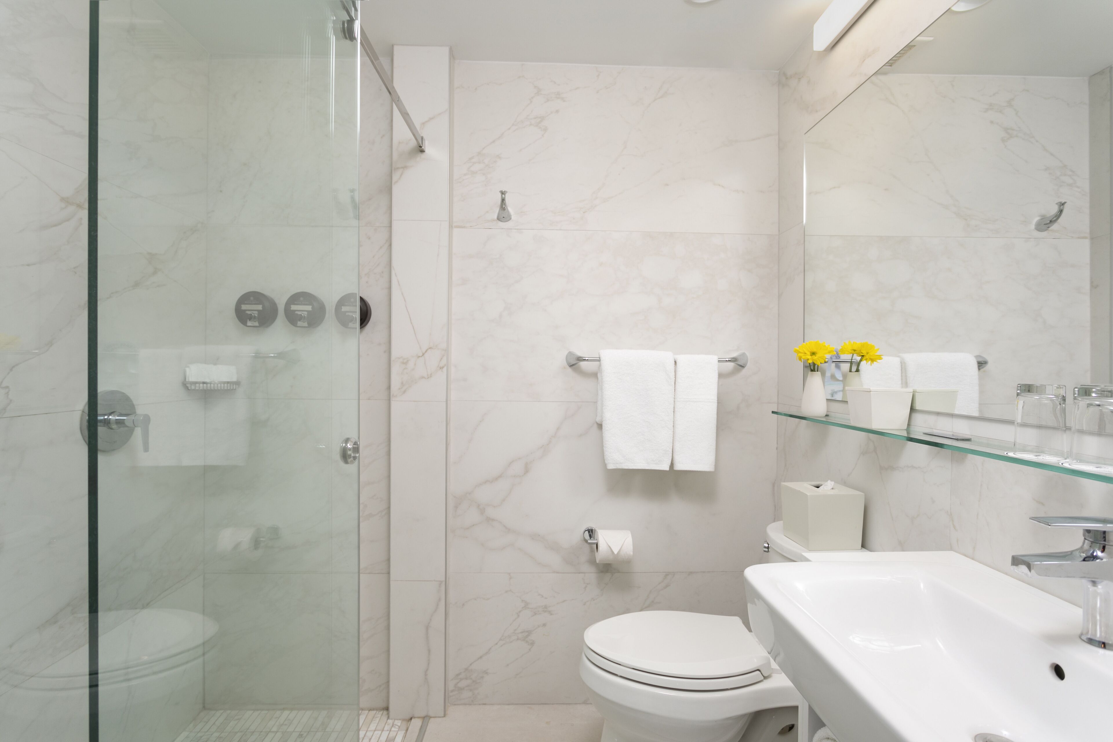 designer toiletries, hair dryer, bathrobes, slippers