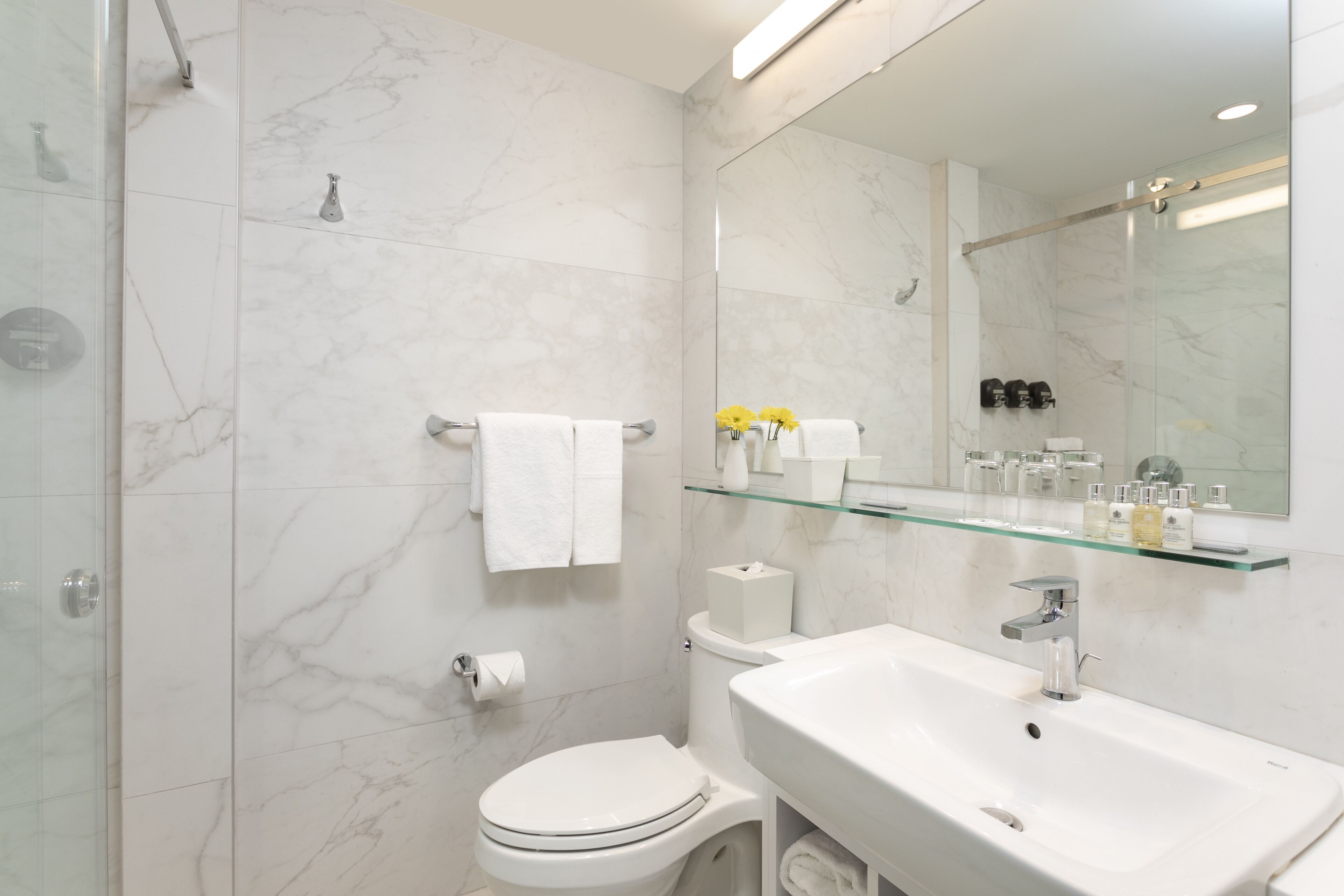 designer toiletries, hair dryer, bathrobes, slippers