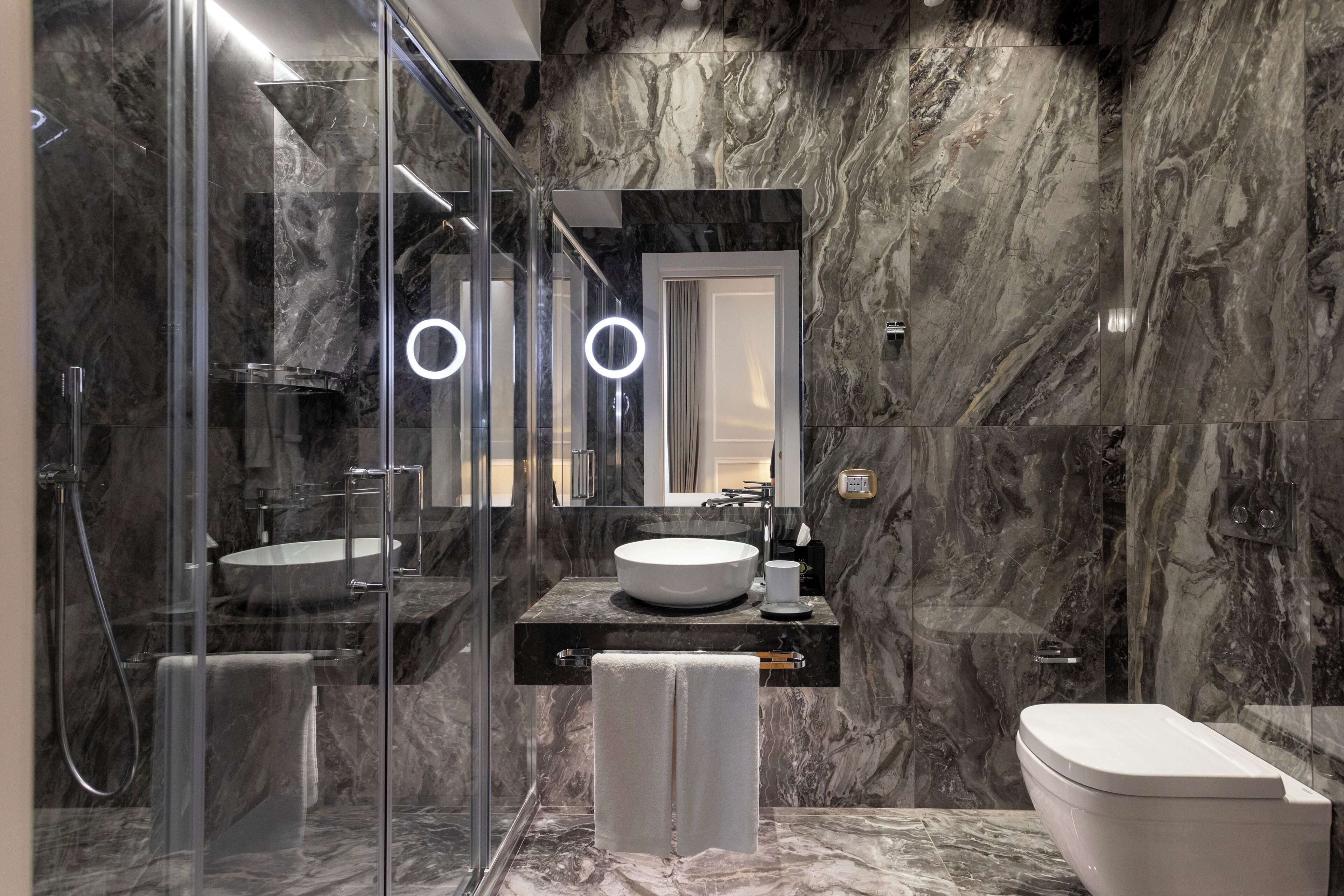 rainfall showerhead, designer toiletries, hair dryer, slippers