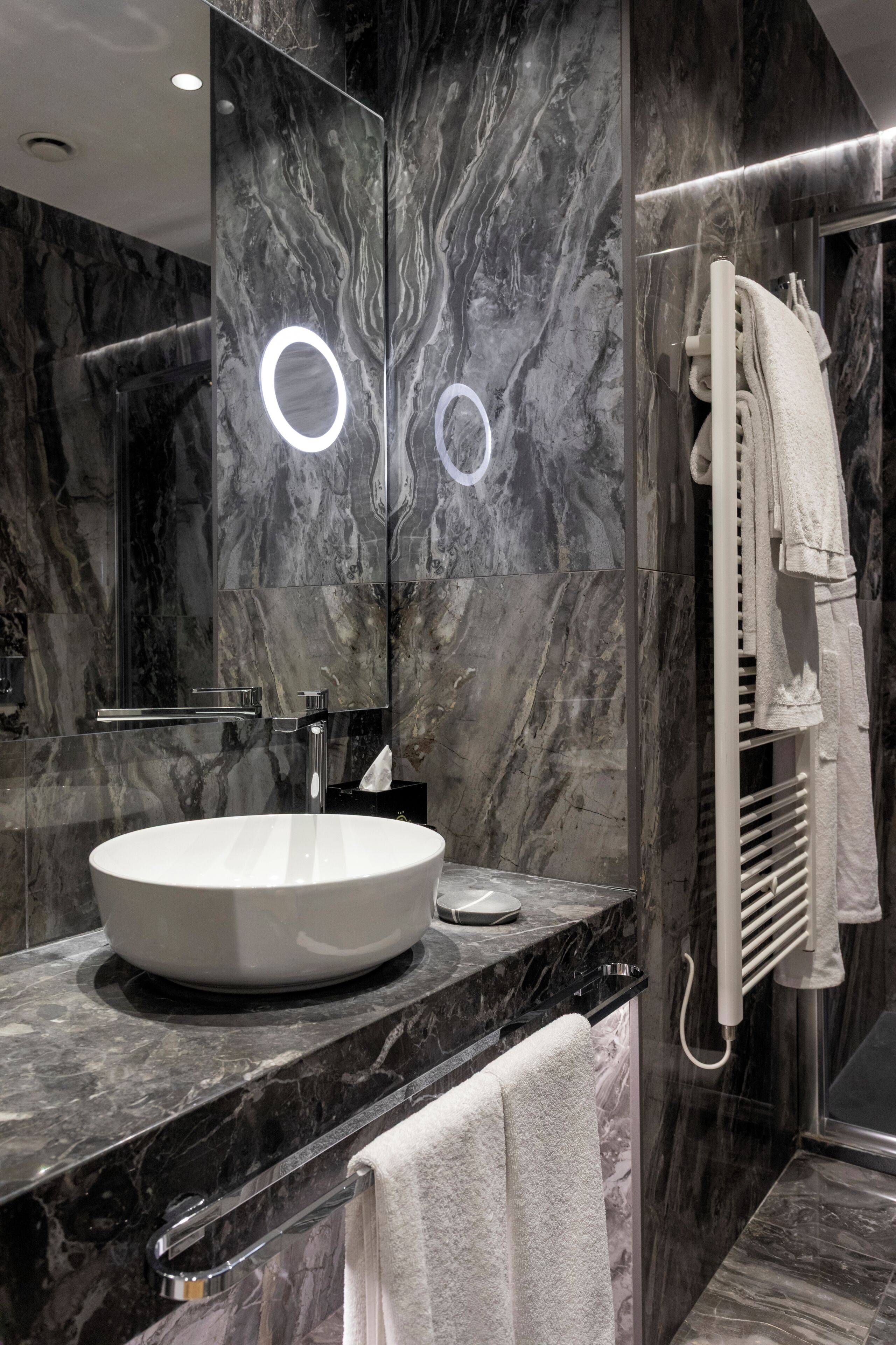 deluxe | bathroom | rainfall showerhead, designer toiletries, hair dryer, slippers