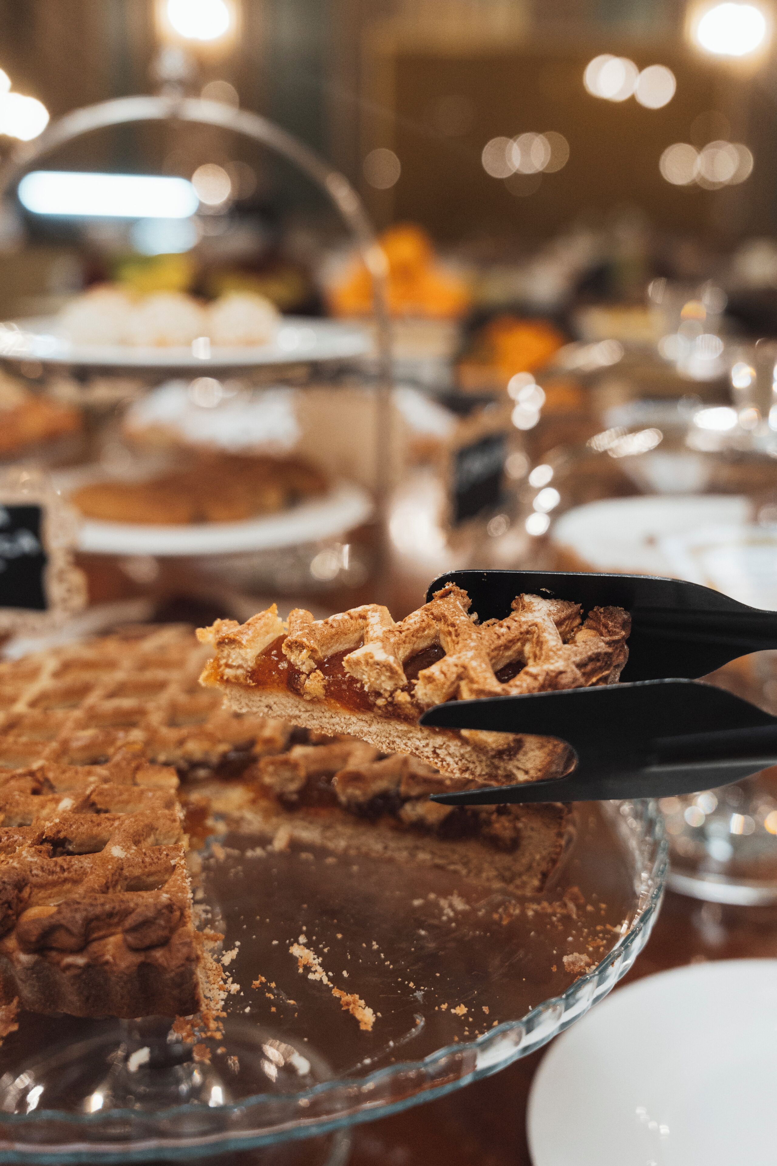 A dessert buffet with a variety of cakes and pastries.