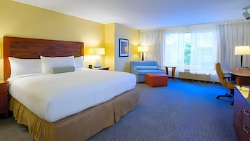 Hypo-allergenic bedding, desk, laptop workspace, blackout drapes