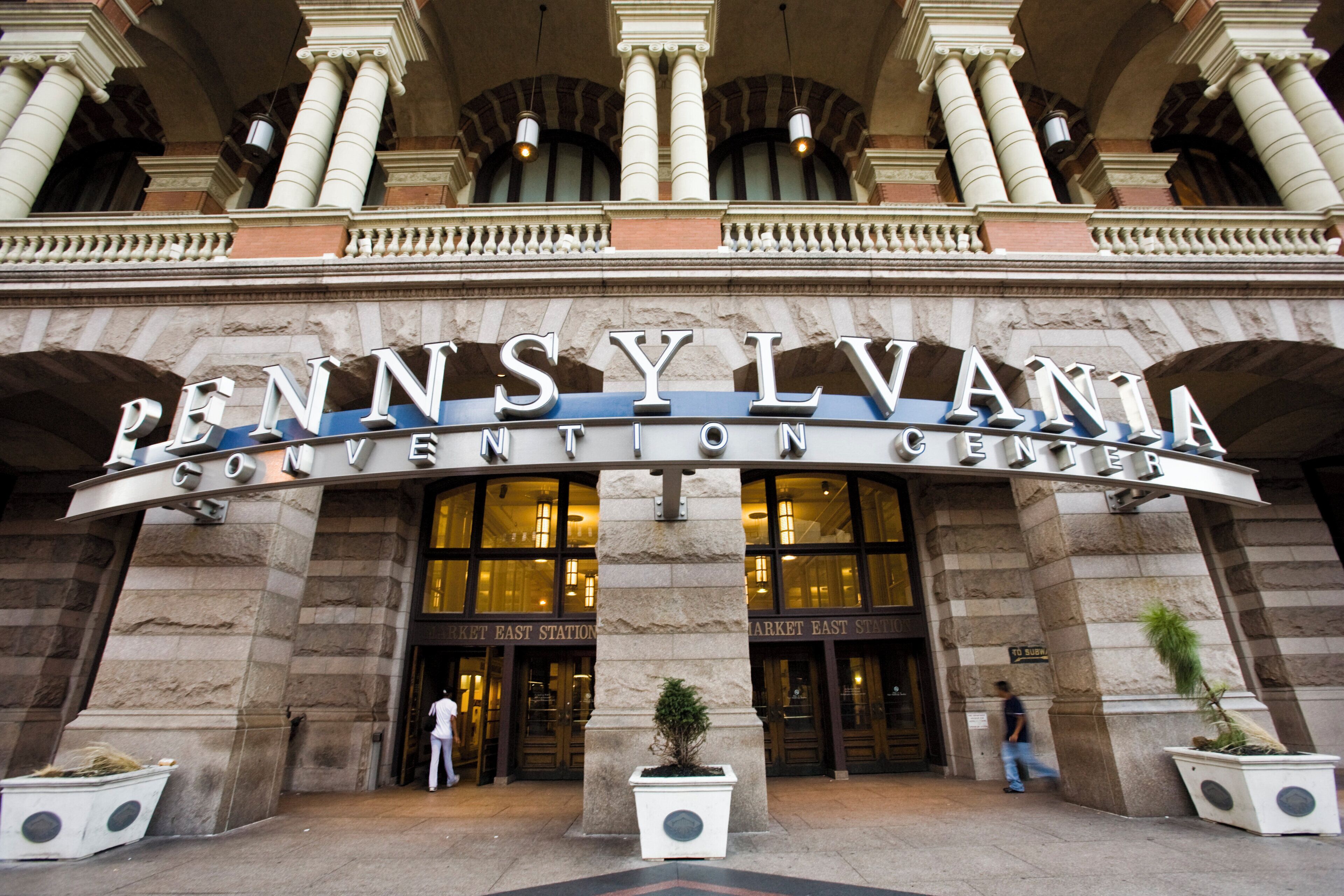 The Pennsylvania Convention Center entrance with stone columns and a large sign above the doors.