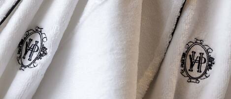 A white fabric with embroidered monograms.