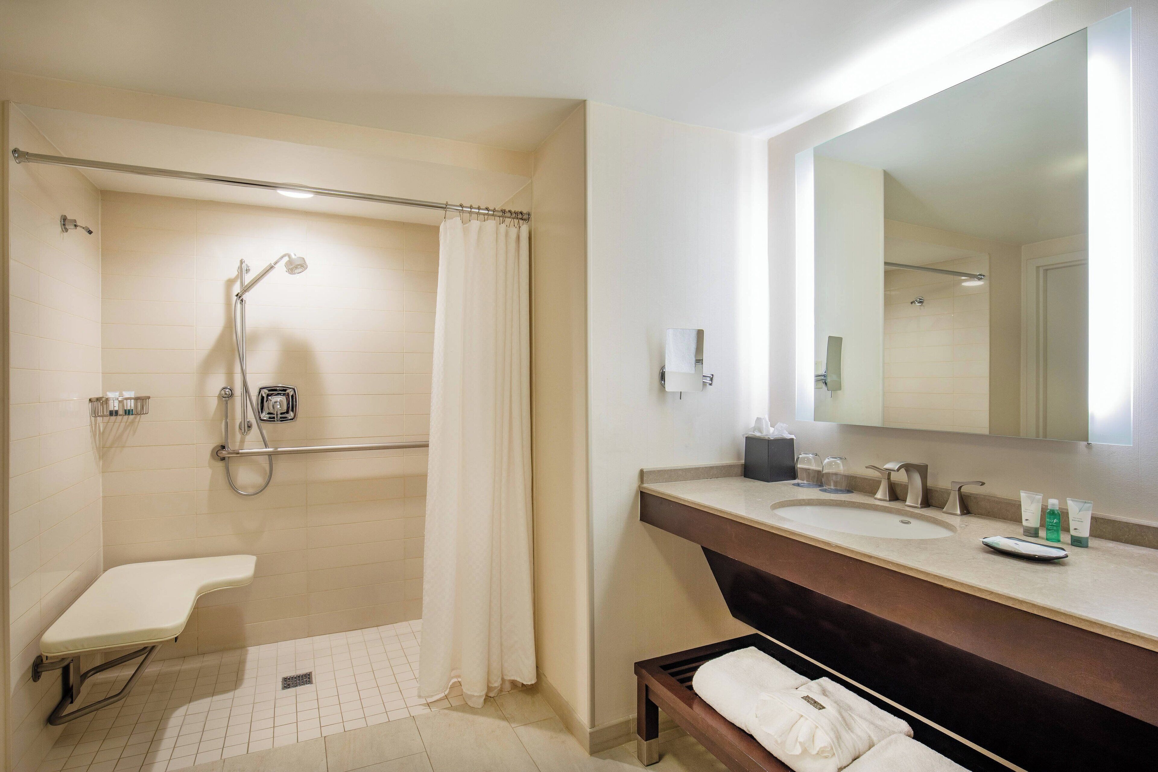 combined shower/bathtub, designer toiletries, hair dryer, bathrobes