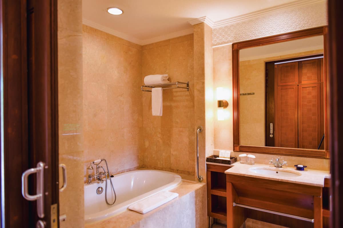 separate bathtub and shower, hair dryer, bathrobes, slippers