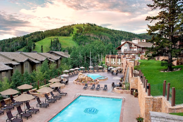 2 outdoor pools, open 7:00 AM to 9:00 PM, pool umbrellas, sun loungers