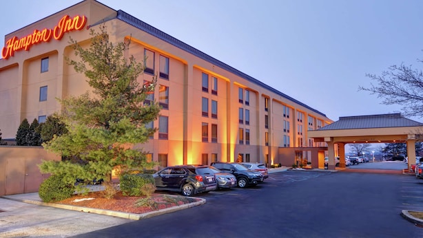 A Hampton Inn hotel with a parking lot and a covered entrance.