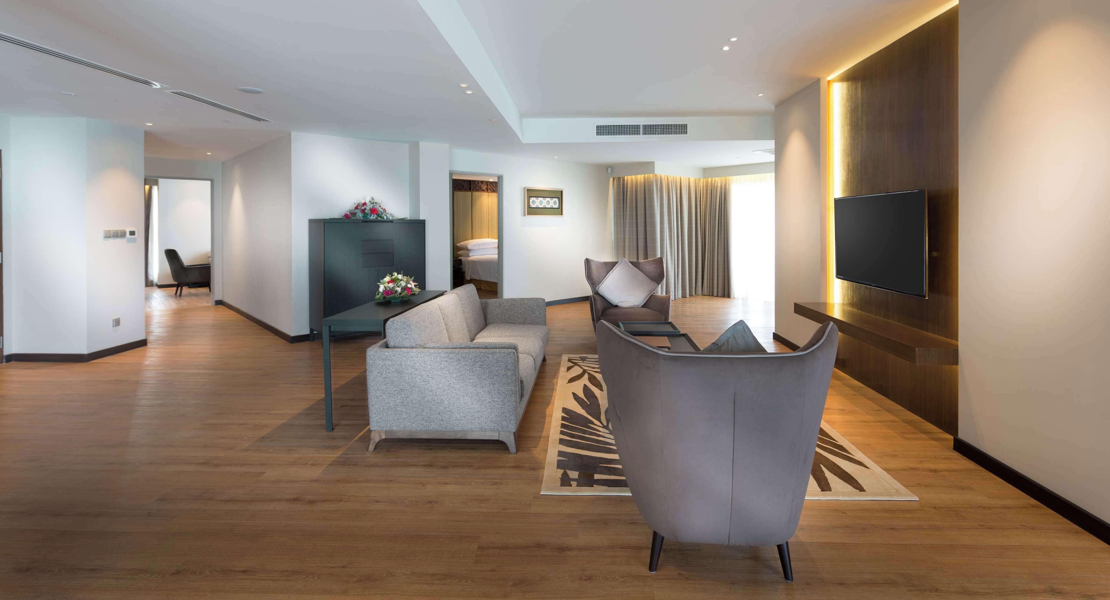 presidential suite, 1 king bed, terrace | living area | 40-inch flat-screen tv with satellite channels, tv, ipod dock