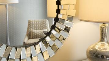 A mirror with a metallic, geometric frame.