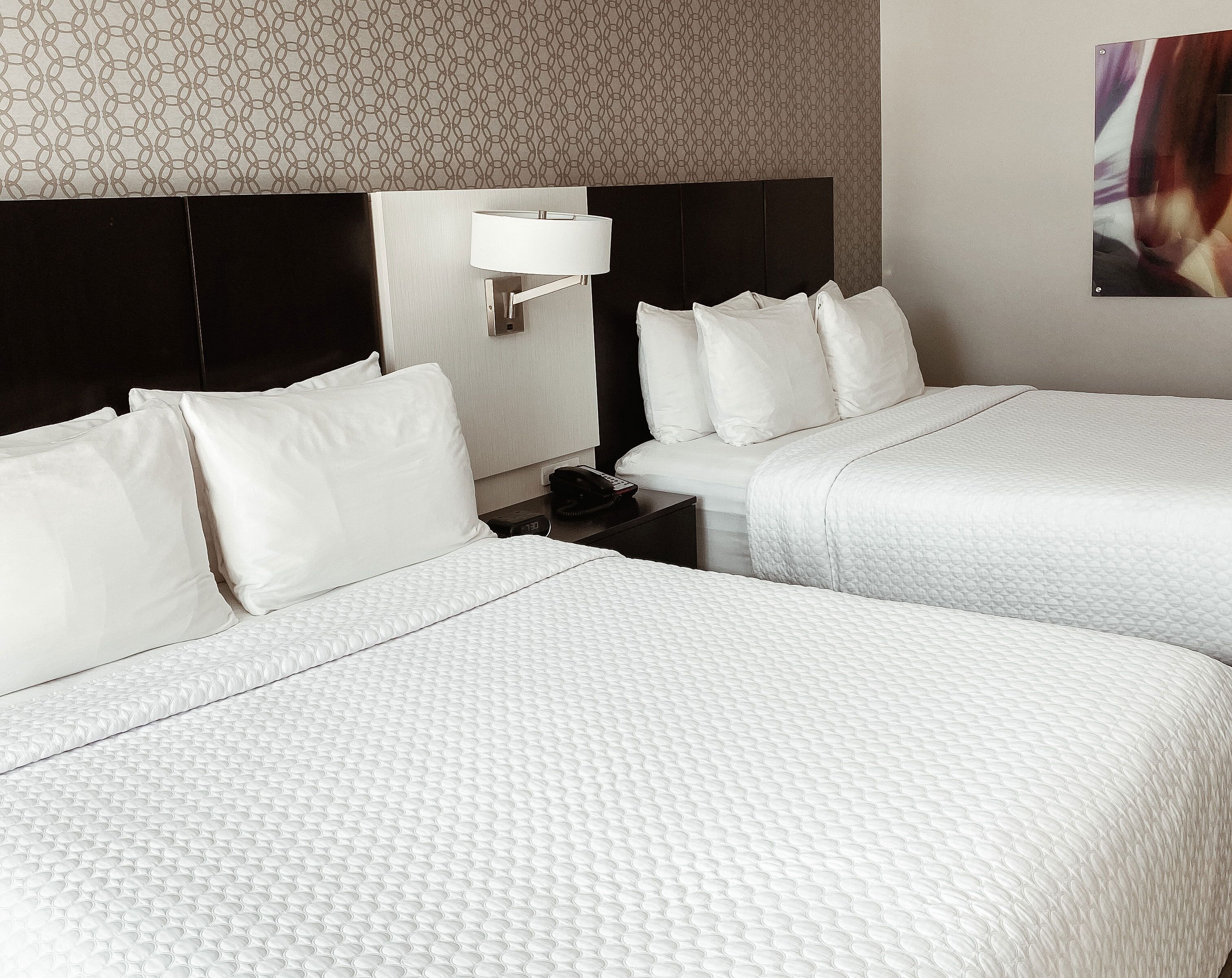 premium bedding, pillow-top beds, desk, blackout curtains