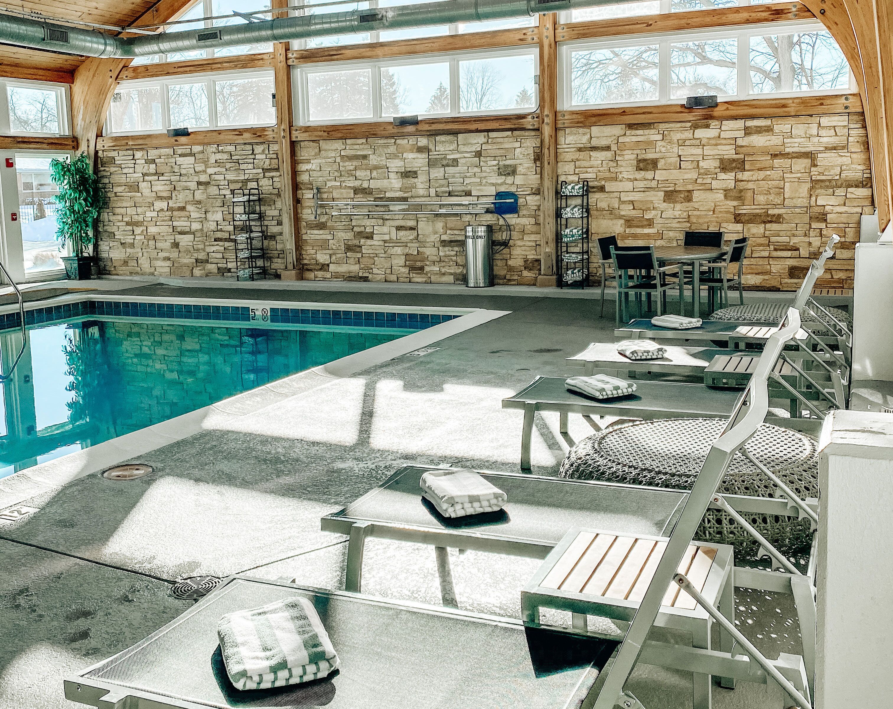 Indoor pool, open 7:00 AM to 10:00 PM, pool loungers