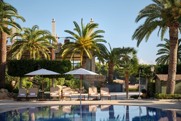 Indoor pool, outdoor pool, pool umbrellas, pool loungers