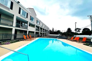 Seasonal outdoor pool, pool umbrellas, pool loungers