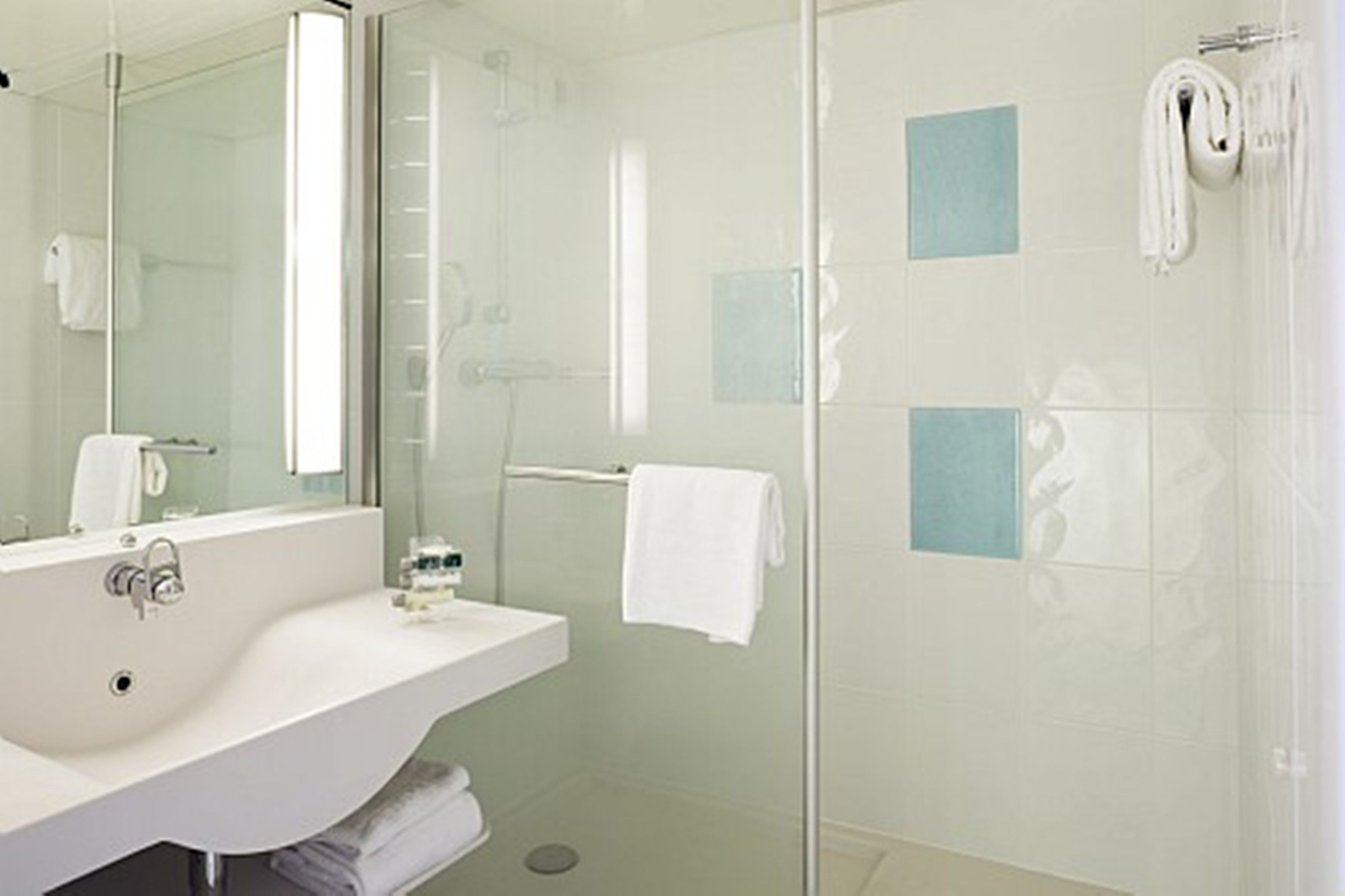 classic room, multiple beds, pool view | bathroom | rainfall showerhead, eco-friendly toiletries, hair dryer, towels