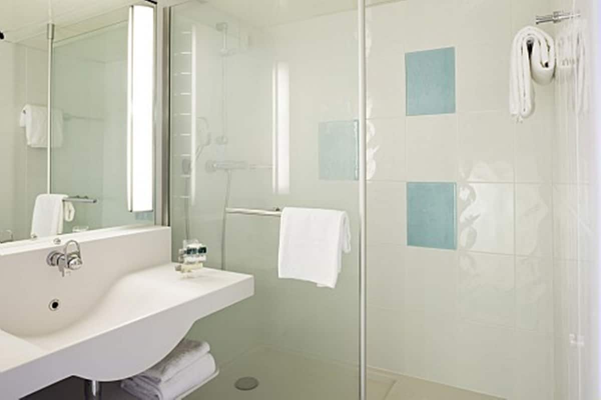 classic room, multiple beds, pool view | bathroom | rainfall showerhead, eco-friendly toiletries, hair dryer, towels