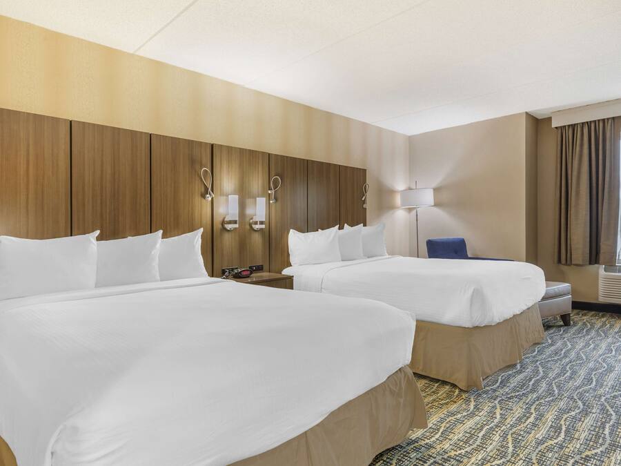 Hypo-allergenic bedding, desk, laptop workspace, blackout curtains