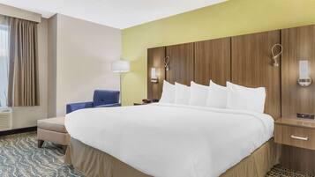 Hypo-allergenic bedding, desk, laptop workspace, blackout drapes