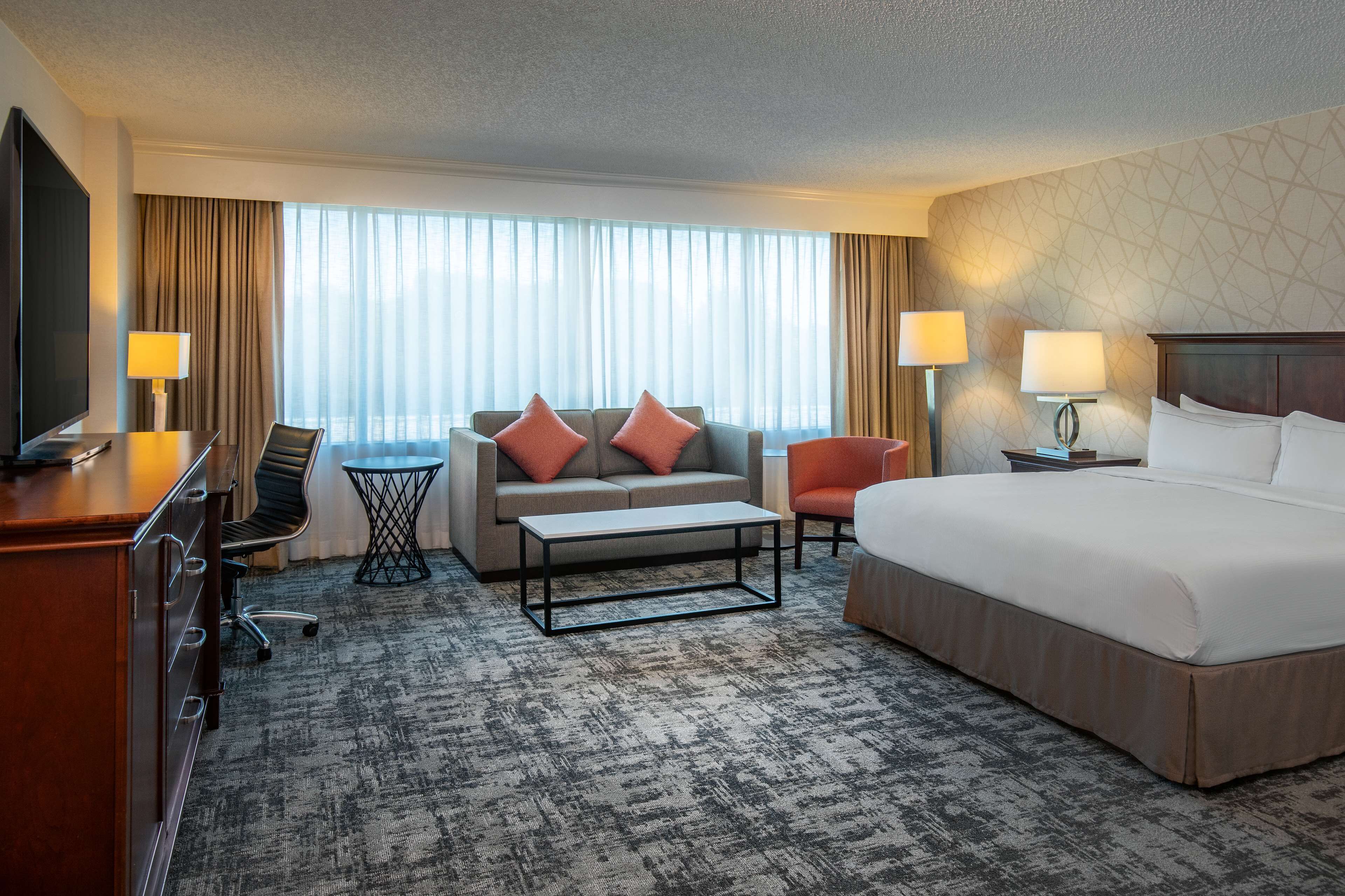 junior suite | living area | 55-inch lcd tv with digital channels, tv, mp3 dock