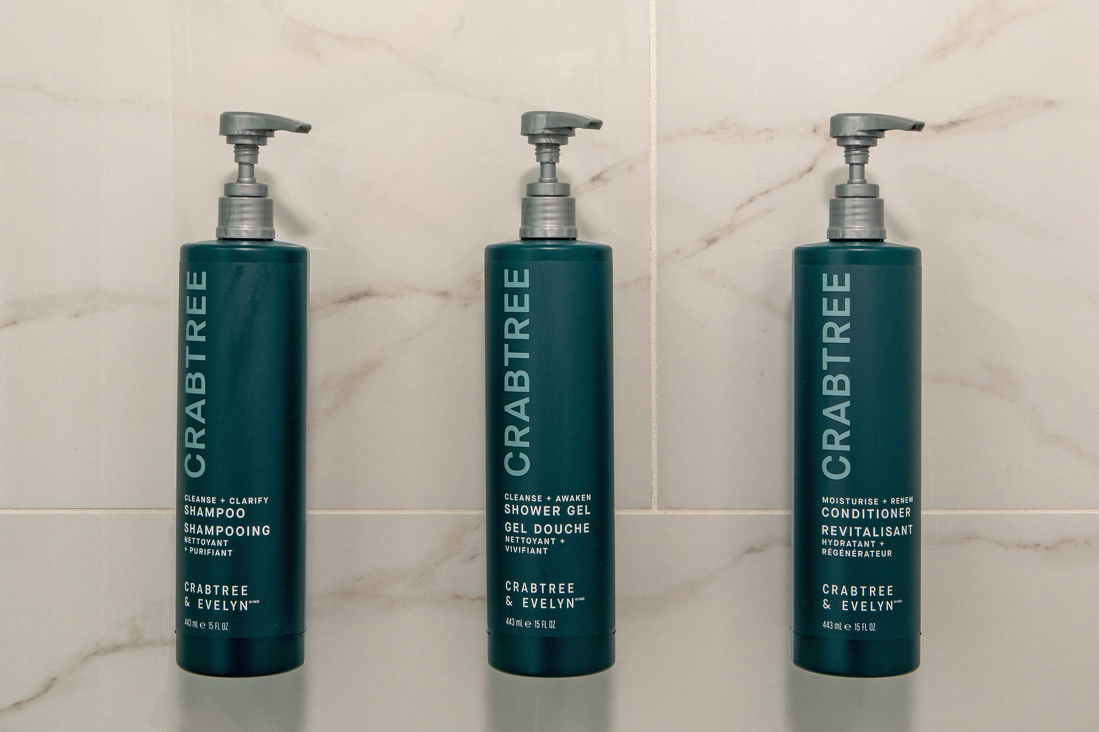 bathtub, designer toiletries, hair dryer, towels