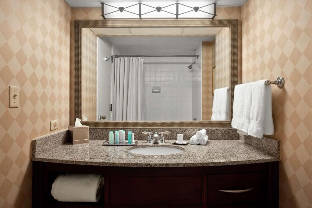 Bathroom | Bathtub, designer toiletries, hair dryer, towels