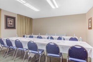 A conference room with tables, chairs, and water bottles. - Days Inn by Wyndham Dublin GA (Dublin)