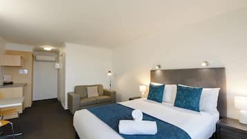 Desk, laptop workspace, blackout curtains, iron/ironing board