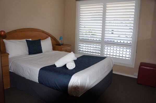 Desk, laptop workspace, blackout curtains, iron/ironing board