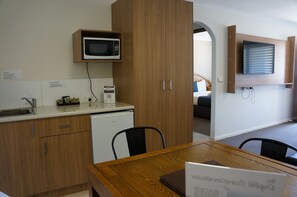 Desk, laptop workspace, blackout curtains, iron/ironing board
