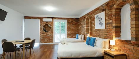 Standard Apartment | Desk, laptop workspace, blackout drapes, iron/ironing board