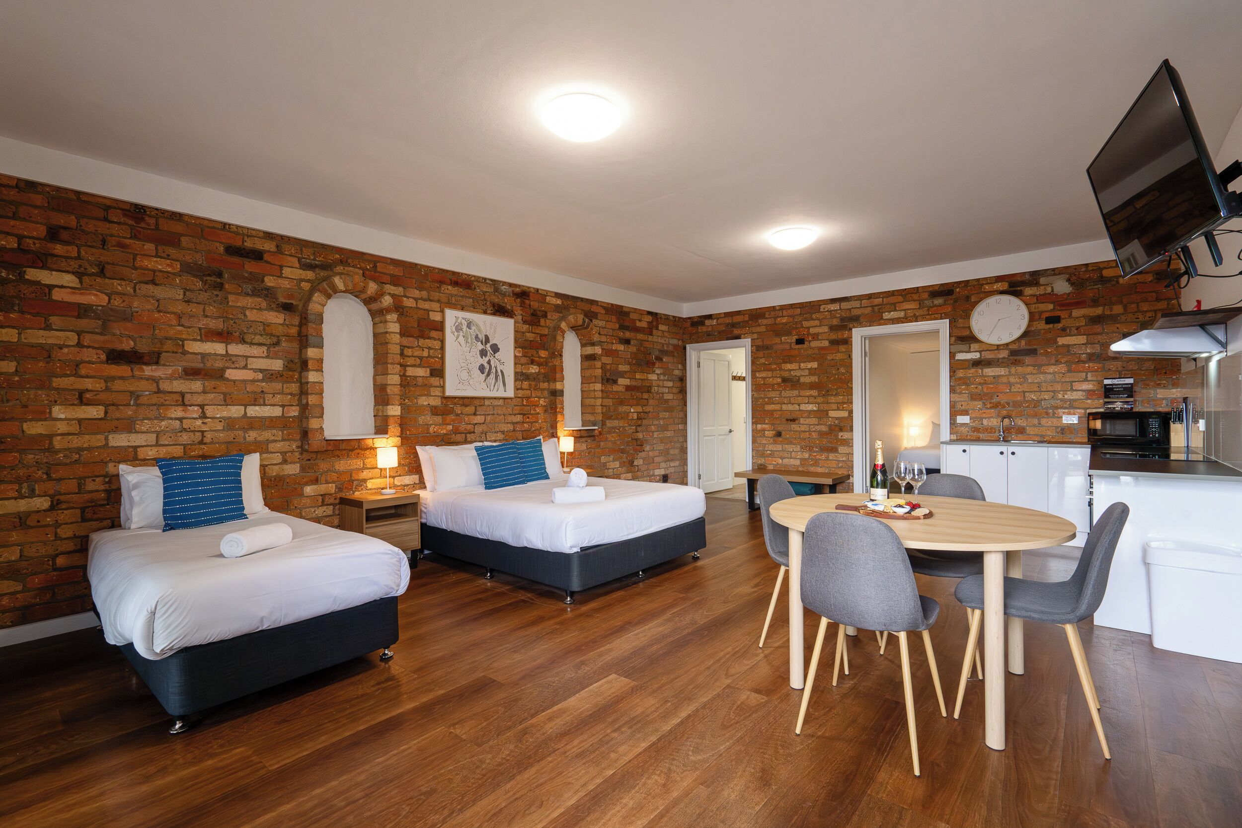 Standard Apartment | Desk, laptop workspace, blackout curtains, iron/ironing board