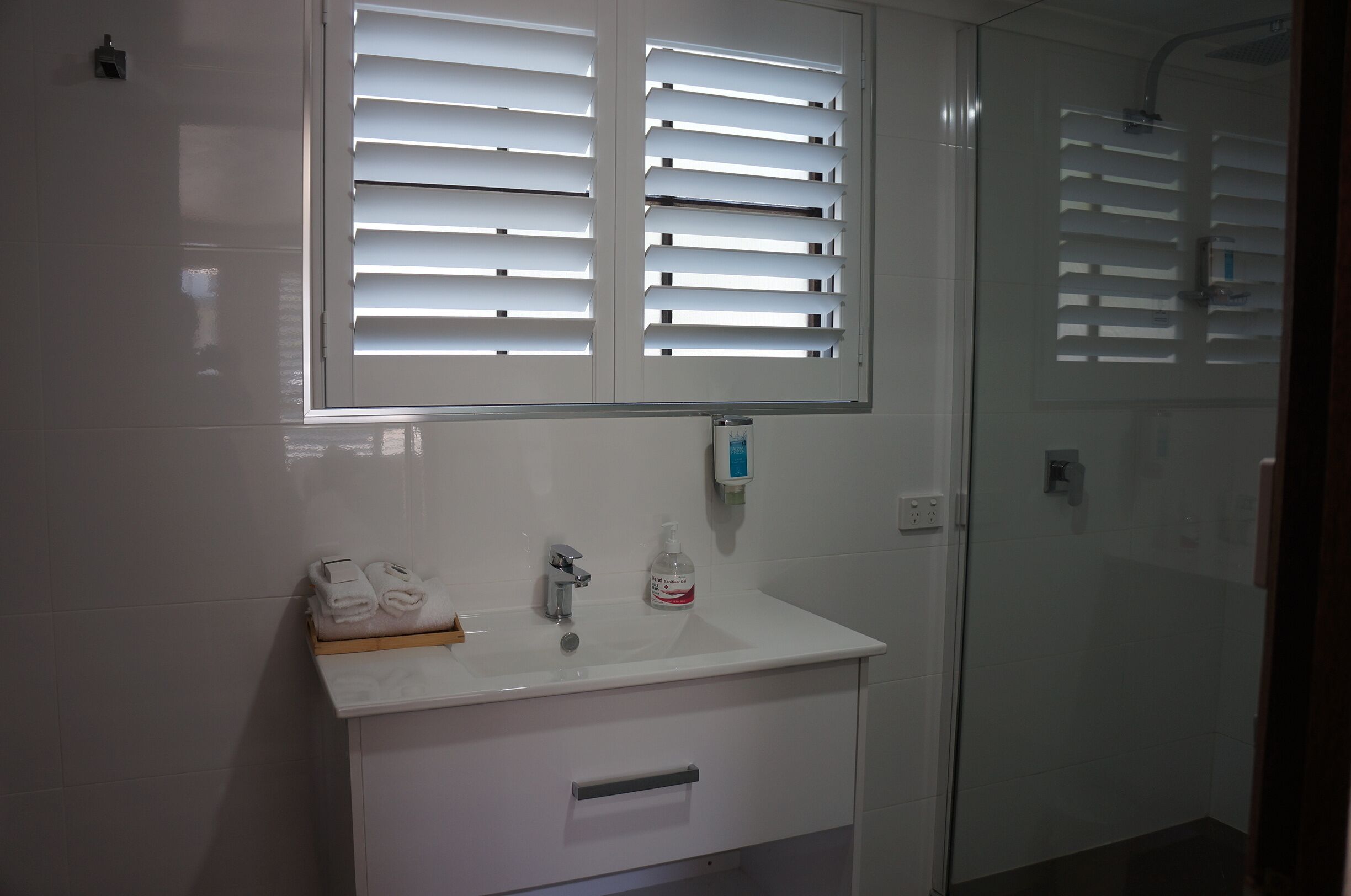 desk, laptop workspace, blackout curtains, iron/ironing board