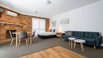 Desk, laptop workspace, blackout curtains, iron/ironing board