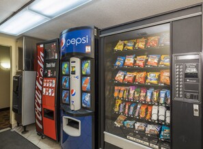 A vending machine with a Pepsi logo, a Coca-Cola machine, and a snack vending machine. - Red Roof Inn & Suites Cincinnati North - Mason (Cincinnati)