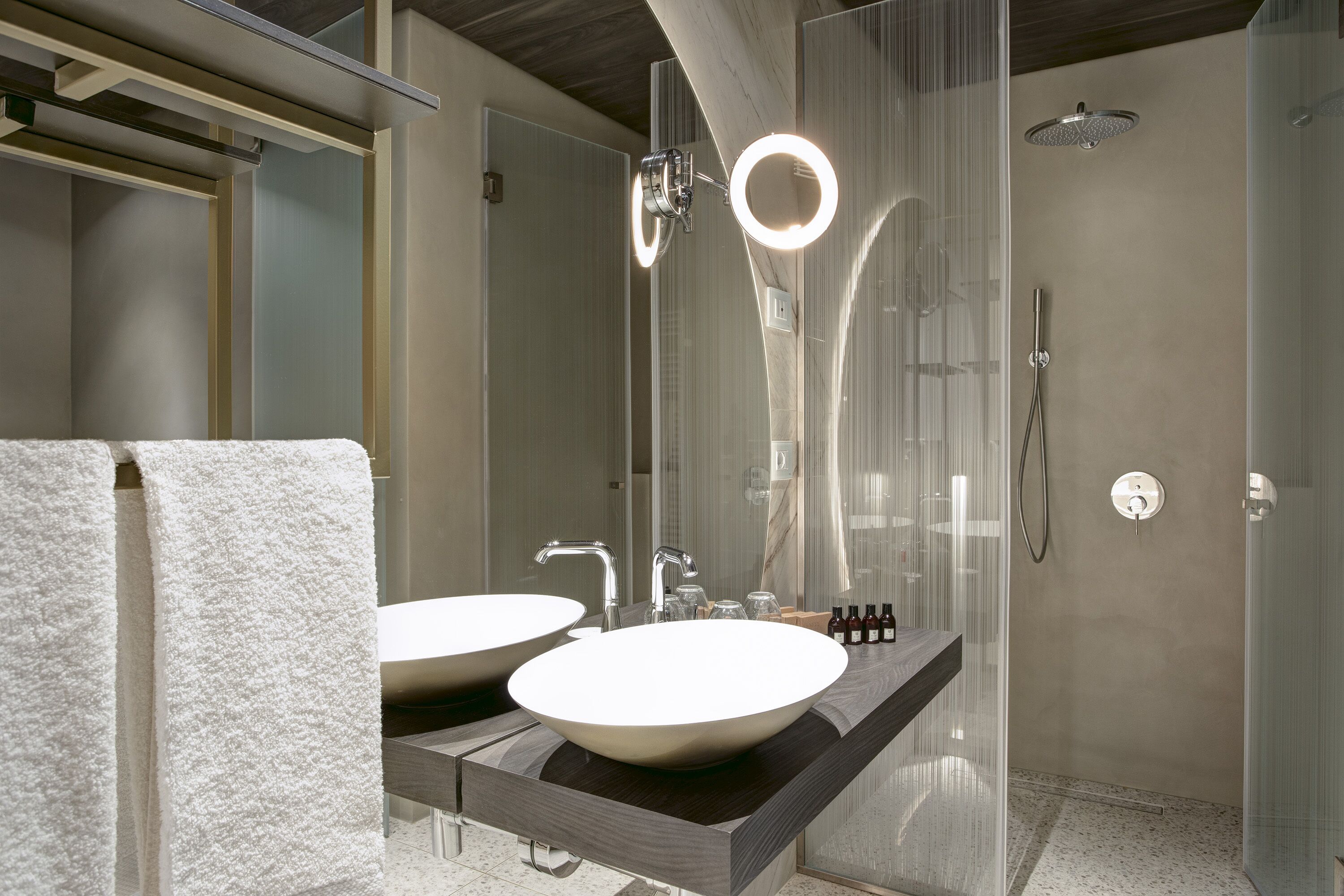 junior suite | bathroom | shower, free toiletries, hair dryer, bathrobes
