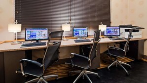 A conference room with three desks, each equipped with a computer, keyboard, and monitor. - Best Western Plus Richmond Airport Hotel (Sandston)