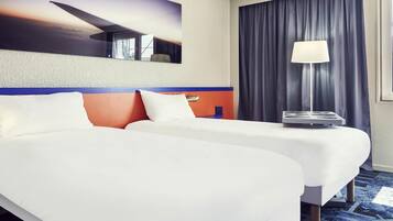 Premium bedding, pillow-top beds, desk, laptop workspace