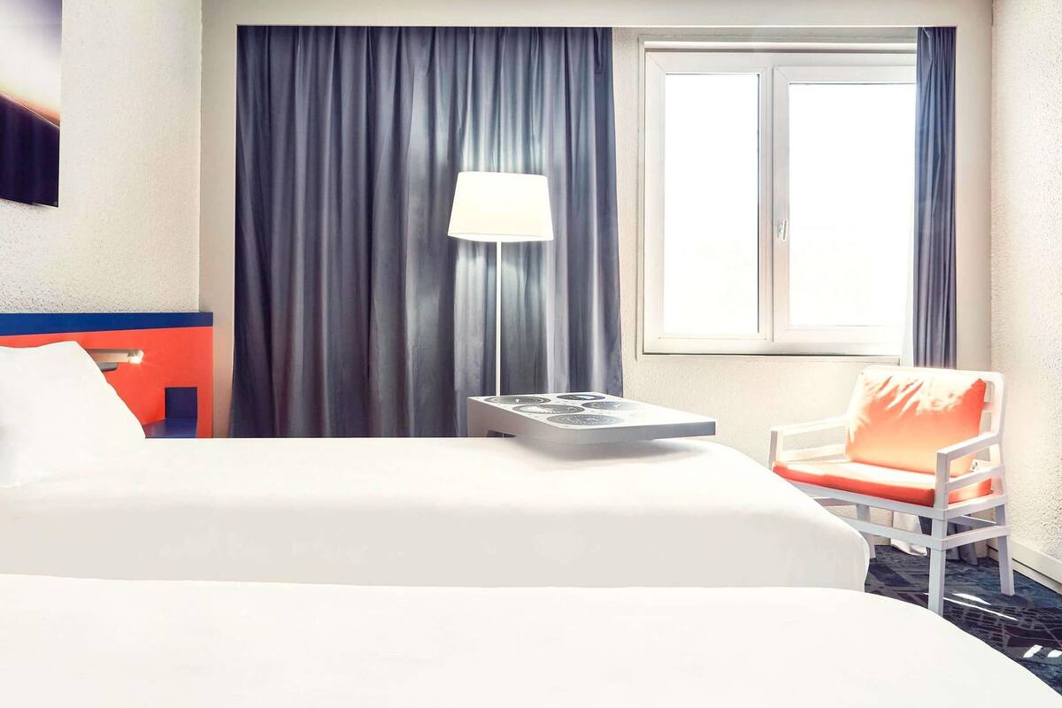 premium bedding, pillow-top beds, desk, laptop workspace