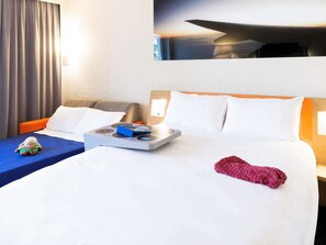 Premium bedding, pillow-top beds, desk, laptop workspace