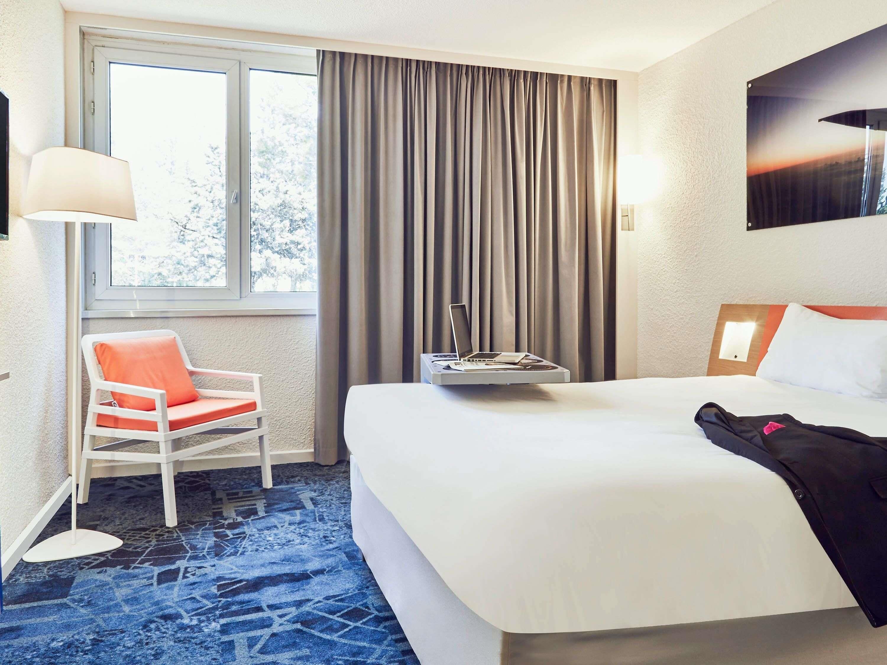 Premium bedding, pillow-top beds, desk, laptop workspace