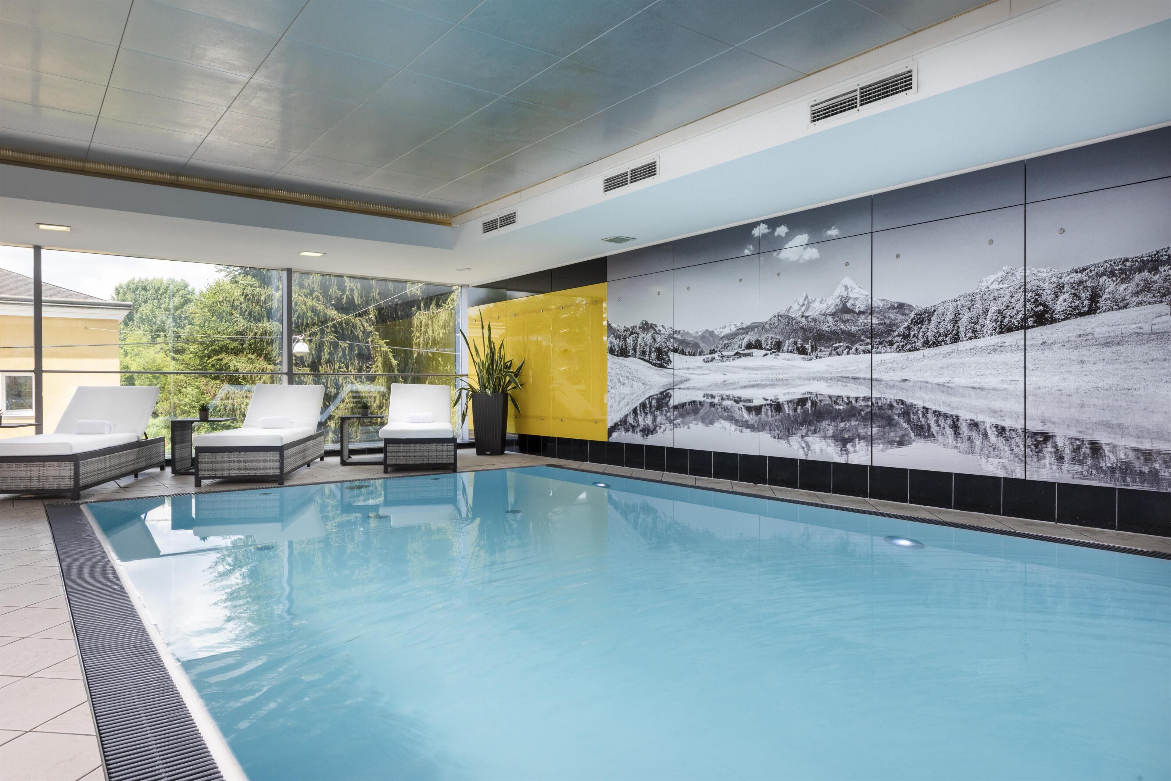 Indoor pool, open 6:00 AM to 10:00 PM, pool loungers