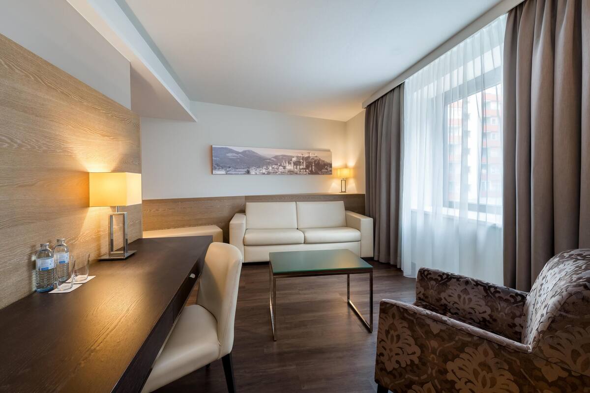 Junior Suite, City View | Hypo-allergenic bedding, in-room safe, desk, laptop workspace