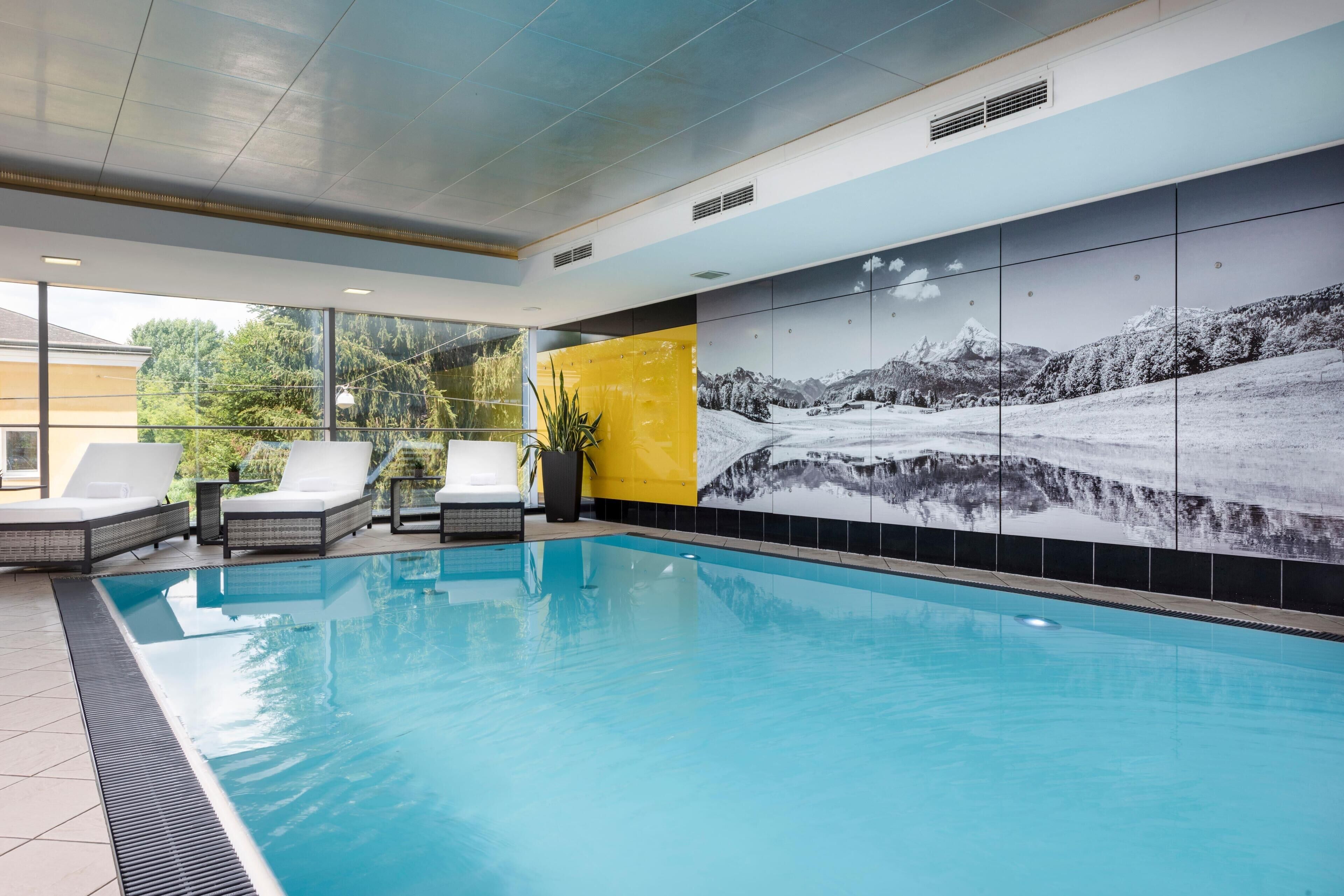 Indoor pool, open 6:00 AM to 10:00 PM, pool loungers