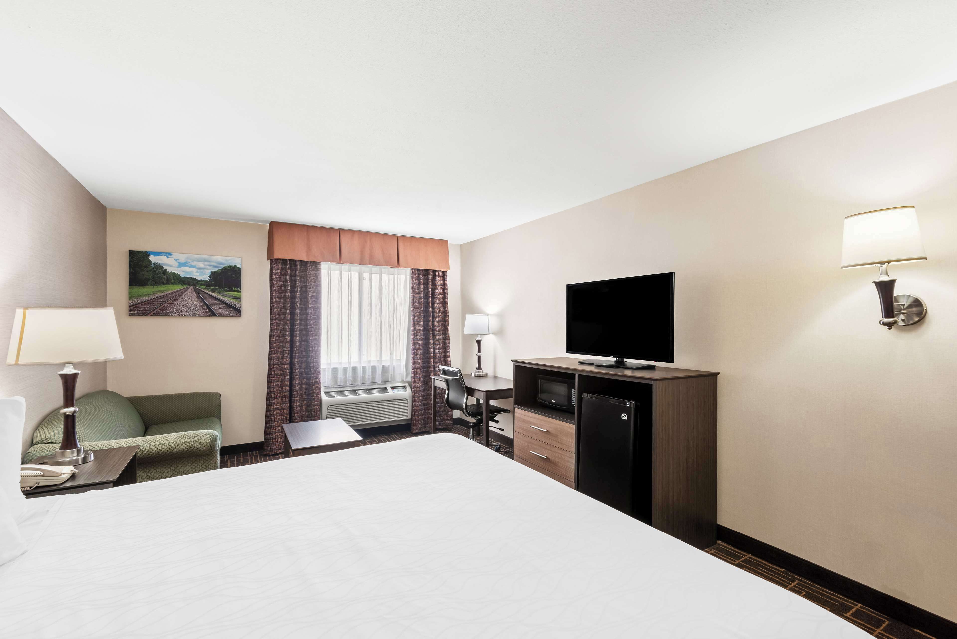 deluxe room, 1 king bed, non smoking, refrigerator & microwave (with sofabed) | premium bedding, iron/ironing board, free wifi, bed sheets